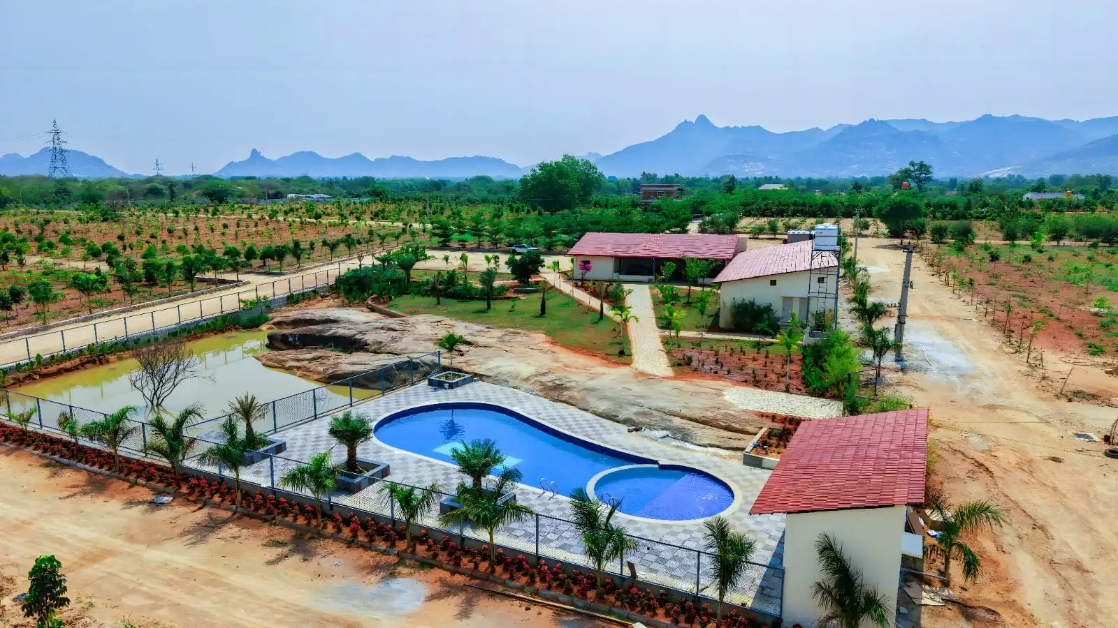 Actual aerial view of the pool and amenities at Sandal Valley